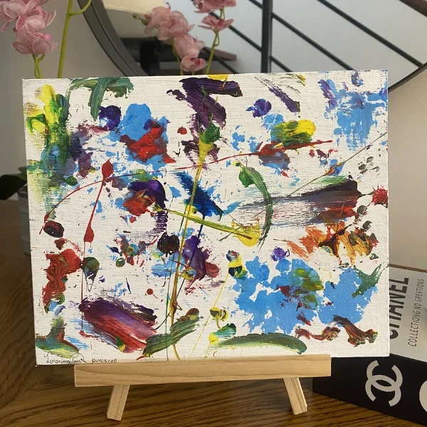 Abstract multicolor splatter painting on white canvas, artwork by Jerónimo Galvis